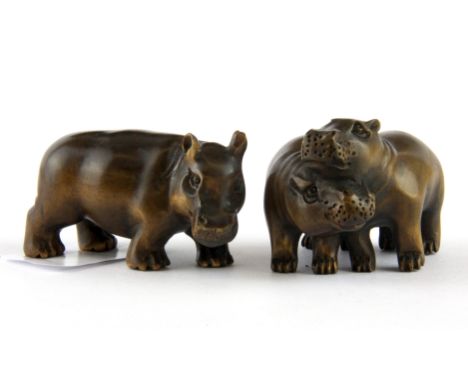 Two carved fruitwood netsuke of hippos, longest 6cm.