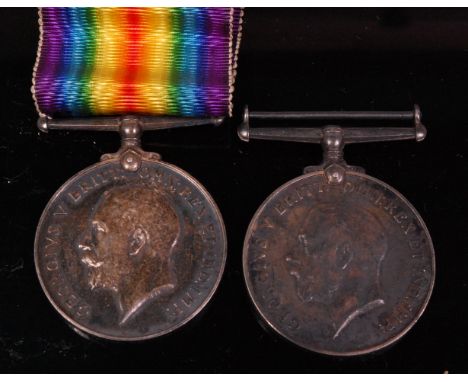 Two WW I British war medals naming 6900 PTE. W.H. BELL. 1-LOND R. and 153914 PTE. A.J. SEMMENS. M.G.C. (2)