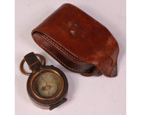 A WW I brass cased prismatic compass, stamped verso Negretti & Zambra, London, in a stitched leather case. Condition Report /