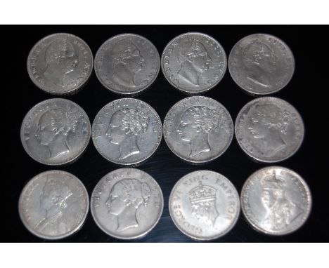 British Colonial, 12 silver one rupee coins to include; 4x 1835 William IV, 5x 1840 Victoria, 1x 1886 Victoria, 1x 1918 Georg