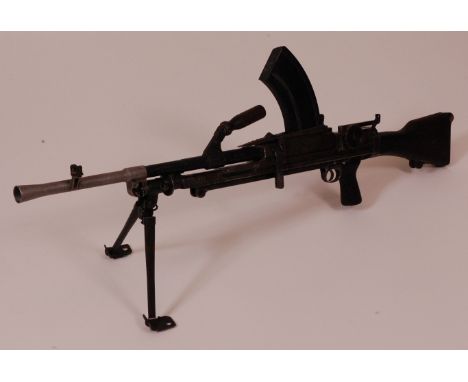 A deactivated British Mk. I Bren light machine gun, stamped AA4252 ASR and dated 1942, having a metal body and wooden stock, 