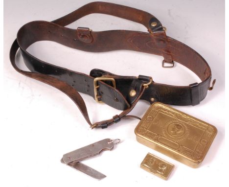 A black leather sam browne belt, together with a 1945 Gibberson & Co. pocket knife, WW I Christamas tin and a brass snuff box