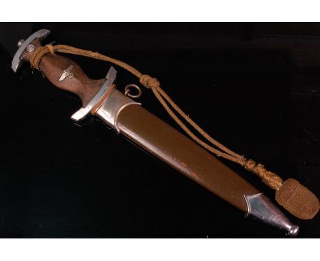 A German Third Reich 1933 pattern dagger, having a 22cm unmarked double edged blade and silvered crossguard, the stained wood