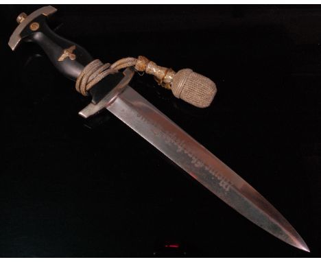 A German Third Reich 1936 pattern SS dagger, the 22.5cm double edged blade etched "Meine ehre heist treue" (My honour is loya