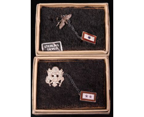 Two WW II American sterling silver sweetheart badges, boxed. (2)