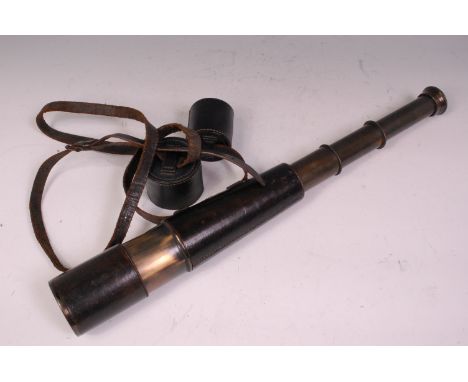 An early 20th century brass and leather clad 3 drawer Army Signal telescope stamped M.D.S. London Army Sig Telescope, with le