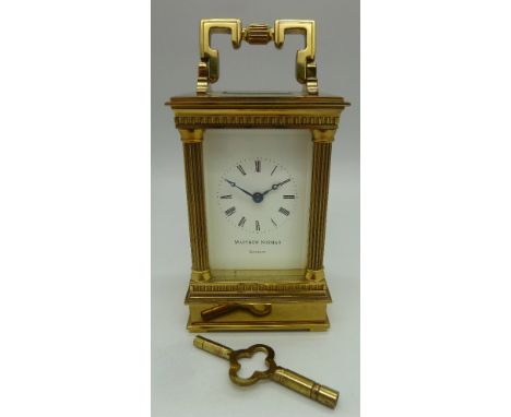 A brass four-glass sided carriage clock, with four doric columns, retailed by Matthew Norman, London, Swiss movement. Height 