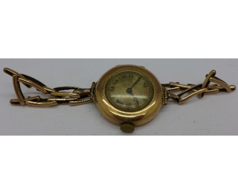 A lady's 9ct gold Rolex manual wind wristwatch, 27mm diameter, fitted with a 9ct gold expandable bracelet strap, not working 