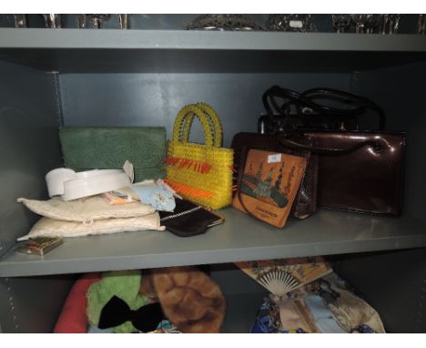 A collection of vintage handbags, handkerchief case and handkerchiefs,collars,compact and more.