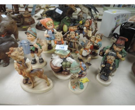 a collection of Goebel figurines and similar.