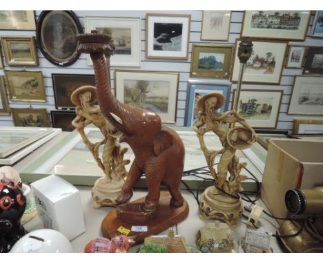 Two oriental style lamp bases and a wooden elephant lamp base.