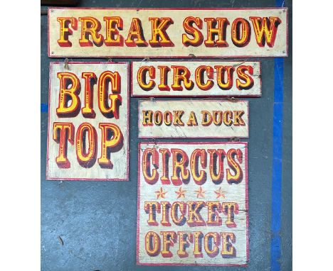 Five painted circus signs: 'Big Top', 'Freak Show', 'Circus Ticket Office', 'Circus' and 'Hook a Duck', the longest 122cmW