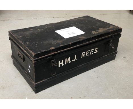 A black painted metal travel trunk, stamped HMJ Rees, 91cmW