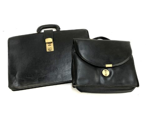 A vintage Papworth black leather briefcase, 48cmW; together with a smaller similar bag (2)