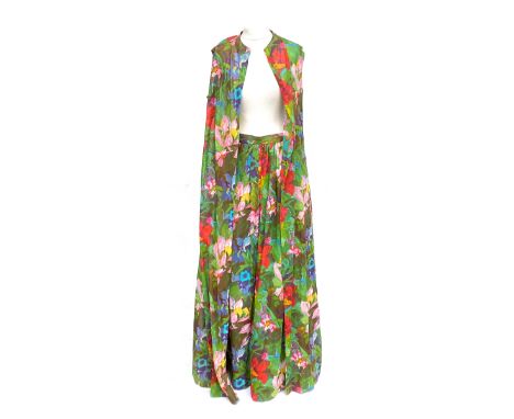 A vintage exotic floral printed silk skirt, lined, with matching long sleeveless jacket, approx. size 10Provenance: from the 