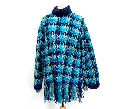 An unusual vintage crocheted blue jumper with tasselled fringe