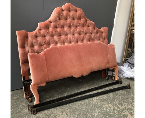 A pink button upholstered king sized bed, the headboard 145cmH