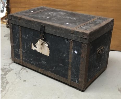 A wooden and steel banded travel trunk, with twin carry handles, bears sticker for General Sir Charles Godwin, 89cmW