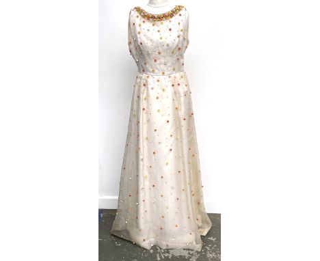 A vintage Hardy Amies white silk sleeveless dress with applied floral beads, with under slip, bears label for Hardy Amies, Sa