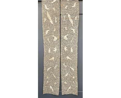 A pair of late 19th century Italian Cantu bobbin lace table runners, decorated with various animals including foxes, peacock,