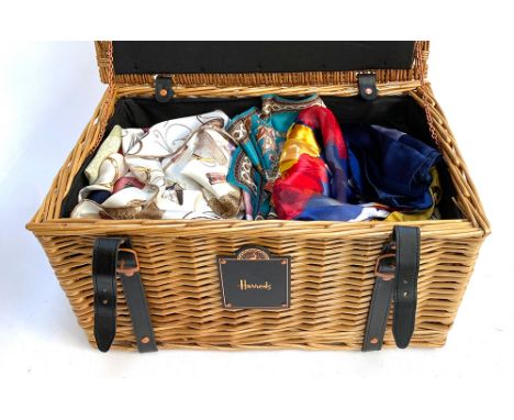 A wicker Harrods hamper containing a large quantity of mainly silk scarves to include Giddens, Fraas, some with hand rolled e