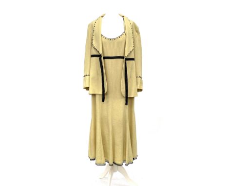A vintage Gold by Michael H pale yellow and black dress with matching jacket, both with black beaded detail, size 14/40