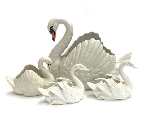 A large Dartmouth pottery swan planter, 28cmH together with one smaller, 14cmH; a Brown-Westhead, Moore &amp; Co swan planter