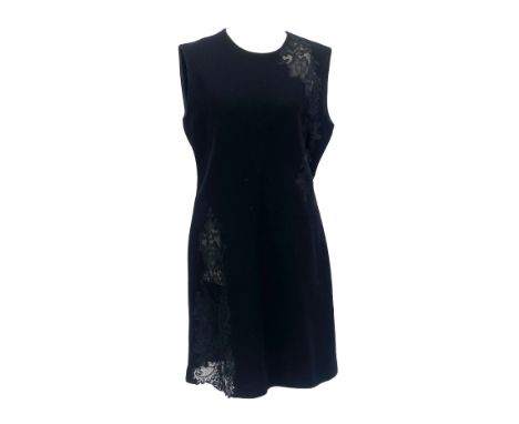 A Gianni Versace couture black sleeveless dress, size 4/10, with asymmetric black lace panels