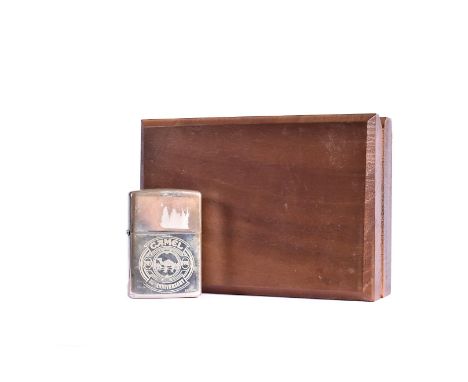 A Sterling Silver Limited Edition 85th Anniversary Camel Zippo Lighter, 18/100, with engraved design to front and dated 1997,