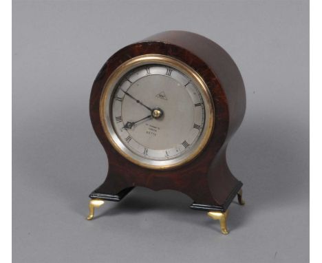 An Edwardian lacquered brass cased carriage clock, the white enamelled dial populated with black Roman and Arabic numerals, s