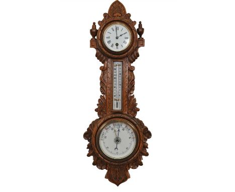 An early 20th century oak cased wall-hanging barometer, with a central dial to base below a thermometer to stem surmounted wi