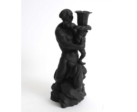 A Wedgwood black basalt candlestick modelled as Triton circa 1875-80, impressed 'A' to the base, 27.5cm high
