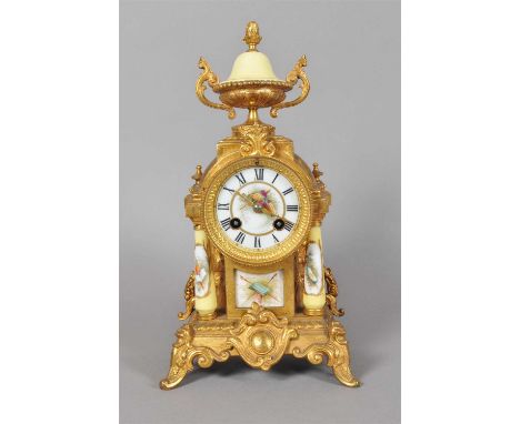 A 19th century gilt metal and porcelain cased mantle clock, the white porcelain dial painted with black Roman numerals within