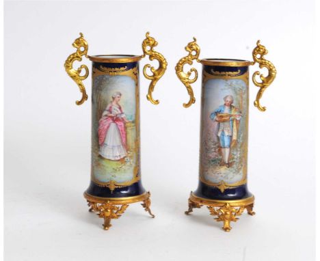 A pair of Sevres Chateau des Tuileries porcelain vases circa 1890 of twin-handled form with ormulu mounts and mythical serpen