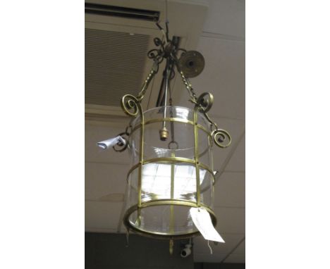 A brass and glass hanging lamp  