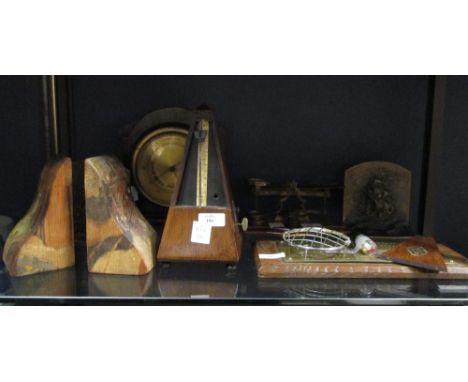 A set of Victorian postal scales with weights, a brass mounted cribbage board, a metronome and a pair of deco bookends  
