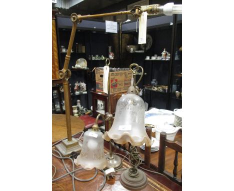 An angled limb lamp, early 20th century, and two table lamps  