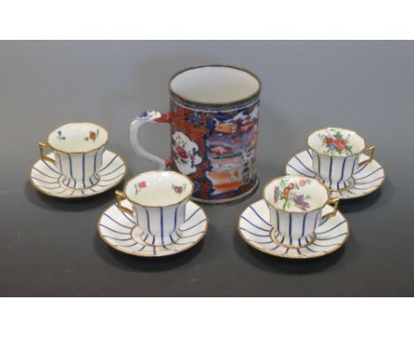 A Chinese export tankard and four blue and white striped and floral decorated teacups and saucers  