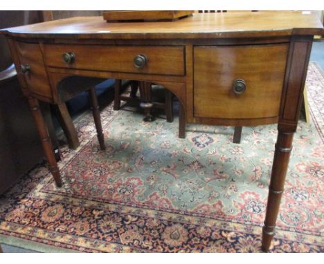 A Regency mahogany bow front dressing table with ebony line border inlay, 75 x 109 x 51cm  