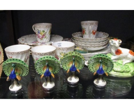 Decorative china to include Dresden cups and saucers, four peacock menu holders, etc.  