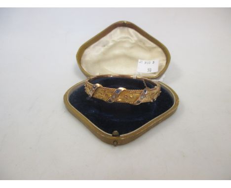 A Victorian 9ct sapphire and diamond hinged bangle, in shaped case  