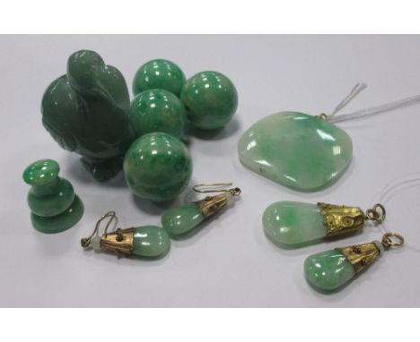 A group of jade and green hardstone to include a carved dodo, a pair of earrings and matching pendant, two other pendants and