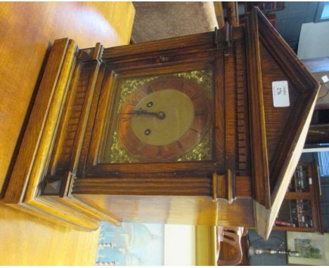 A late 19th century oak cased bracket clock with classical pediment and square brass dial, to an eight day striking movement 