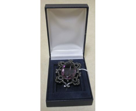 A Victorian silver mounted amethyst brooch  