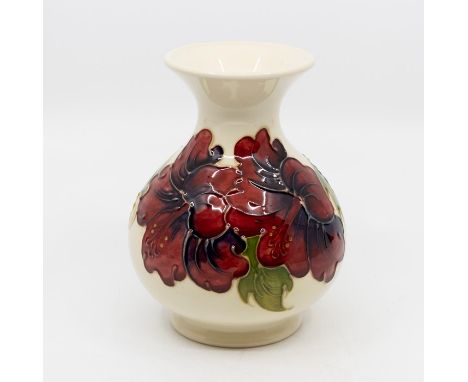 A Moorcroft Hibiscus pattern vase, cream ground, impressed marks, signed to base 'Mandarin' in green, approx 13cm highConditi