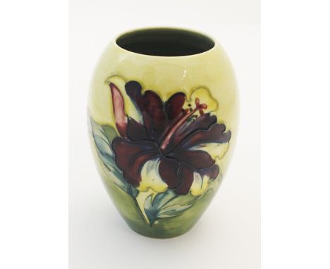 A Moorcroft Hibiscus pattern slender ovoid vase, on a yellow and green ground, circa 1950s, impressed marks to base, approx 1