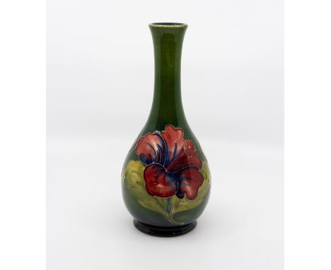 Moorcroft Hibiscus pattern bottle vase, signed in green to base, marked, 27 cms tall approxCrazed but otherwise in good condi