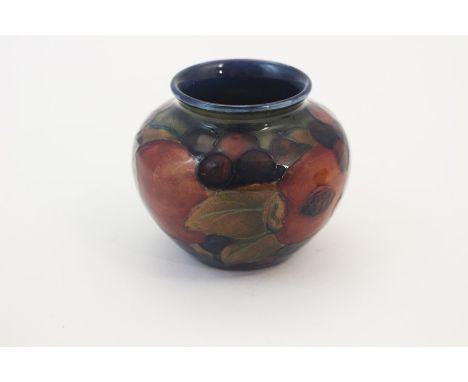 A Moorcroft Pomegranate pattern mall ovoid vase, circa 1920s, approx 6.5cm high, impressed marks to baseCondition: good, no o