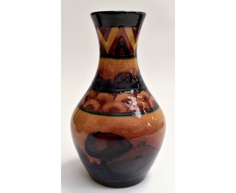 A Moorcroft small baluster vase, Eventide pattern, circa 1920s, approx 14.5cm high, impressed marks and signed to base in blu