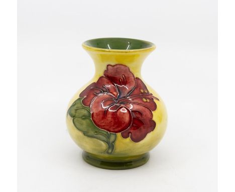 A Moorcroft Hibiscus pattern vase, yellow ground, circa 1970s, impressed marks to base, approx 10cm highCondition: good, no o